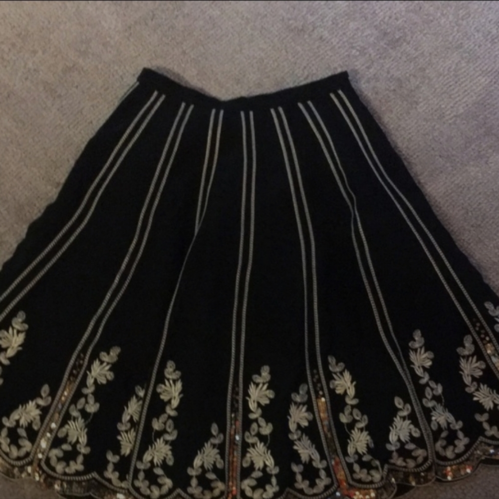 Bebe A line full skirt size 4 black with gold vertical stripes + flower details